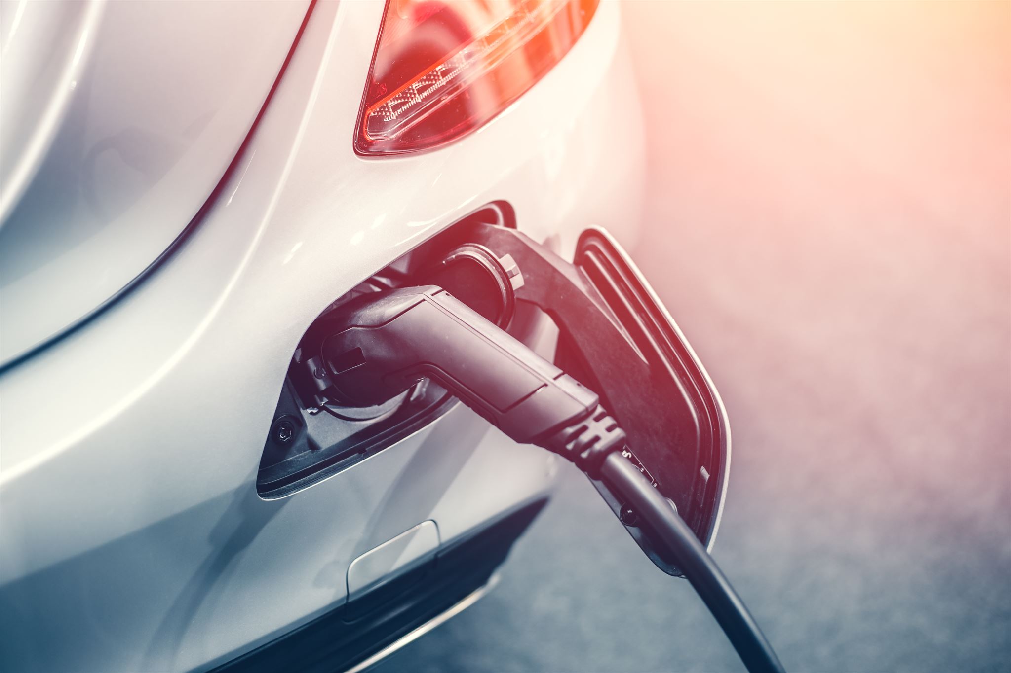 Electric vehicle charging station with fleet vehicles
